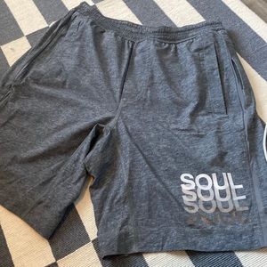 Medium grey Lululemon workout shorts with SoulCycle logo on the bottom
